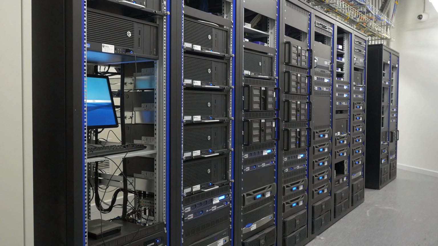 Many Powerful Servers Running in the Data Center Server Room. Many Servers in a Data Center. Many Racks with Servers Located in the Server Room. Bright Display a Plurality of Operating Equipment.